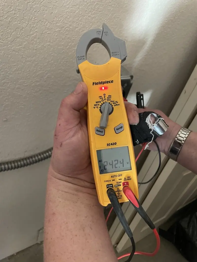 Voltage testing with clamp meter during Circuit Breaker Repair in Elk Grove Village
